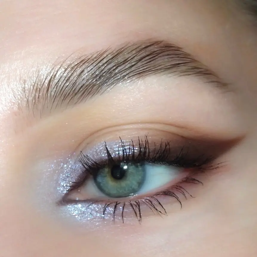 Sparkling eyeshadow enhances blue eye beauty