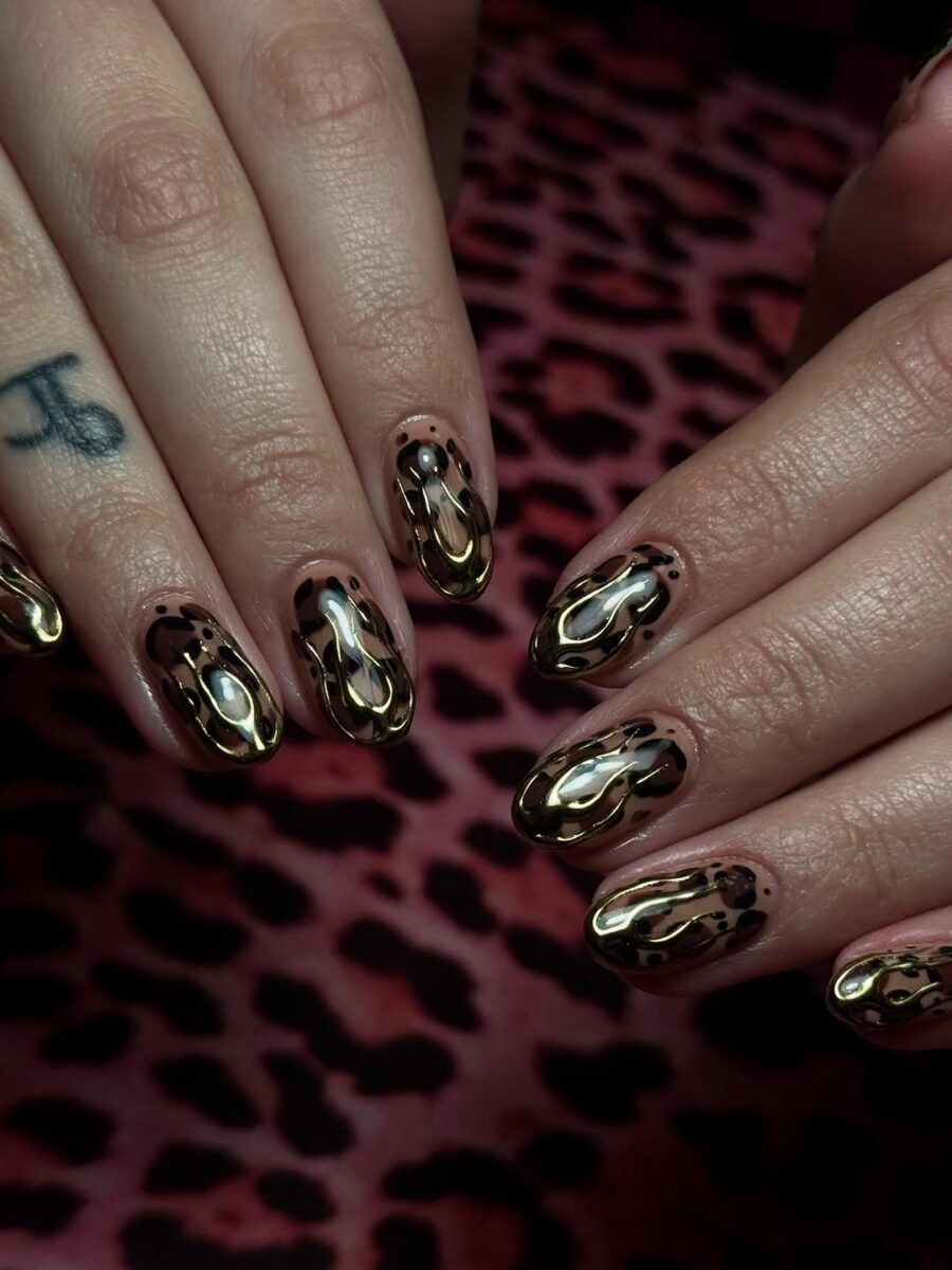 Stylish gold and black animal print nails