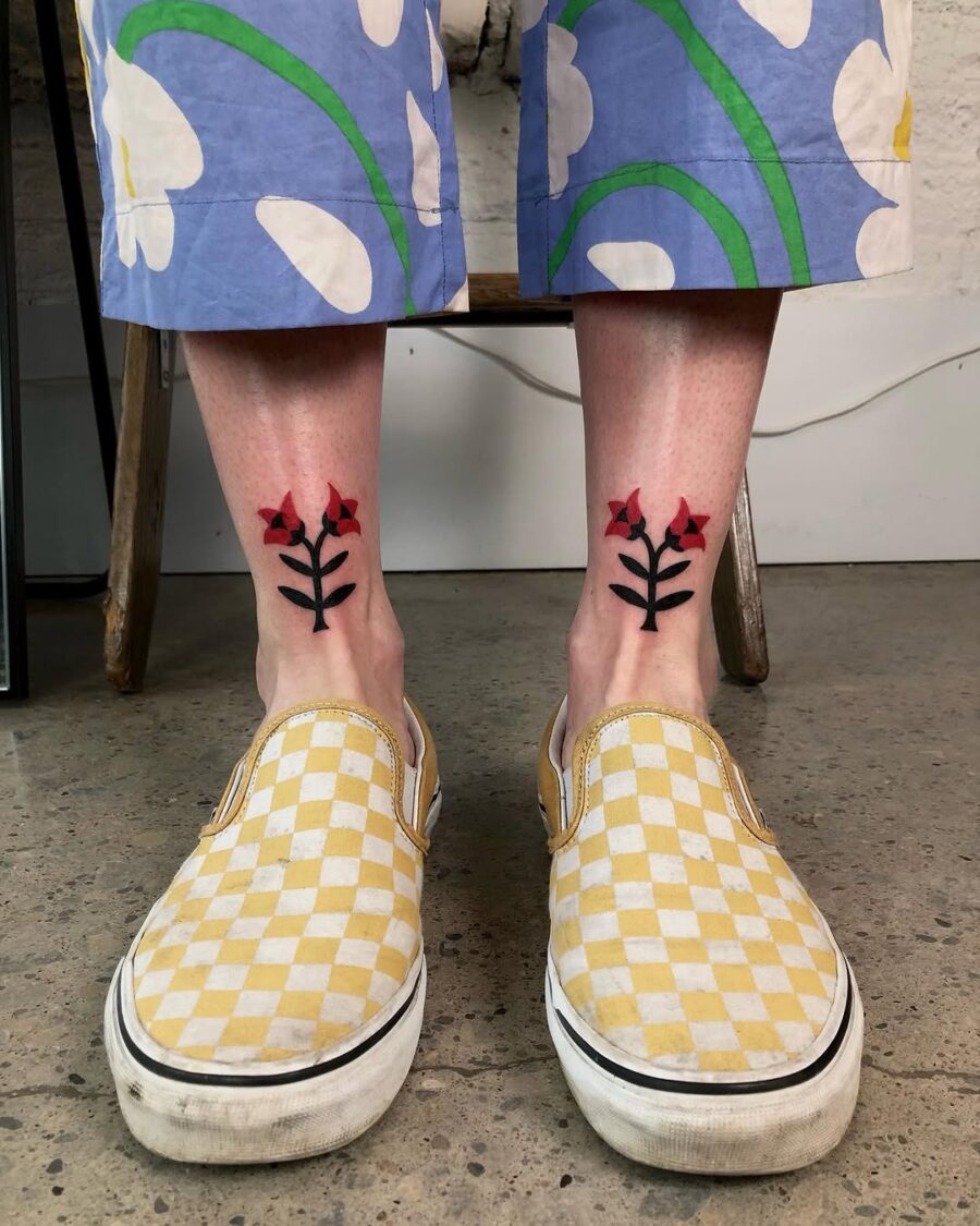 Vibrant floral ankle tattoos with bold colors