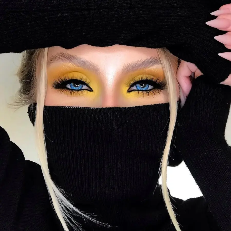 Vibrant yellow eyes with striking blue contrast