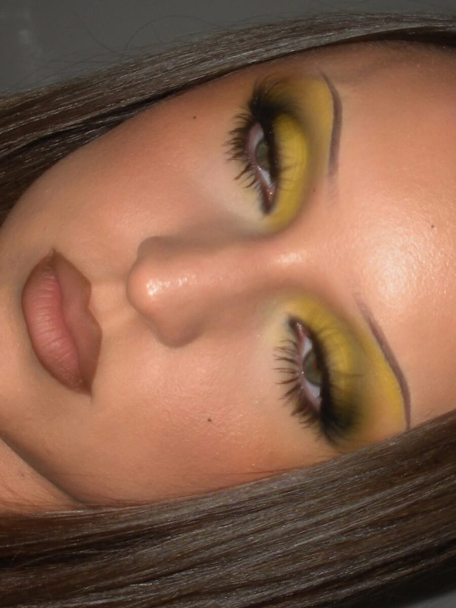 Bright yellow eyeshadow with nude lips