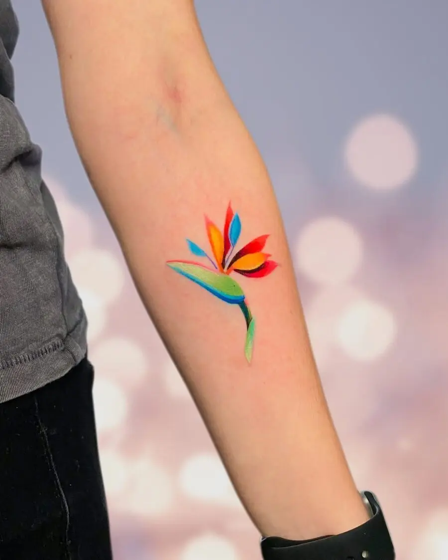 Vibrant flower tattoo with bold color contrast
