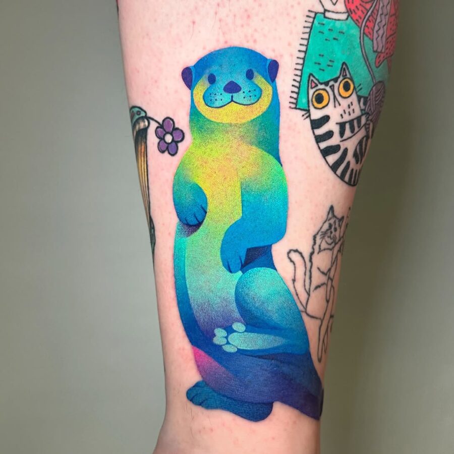 Vibrant otter tattoo bursting with color