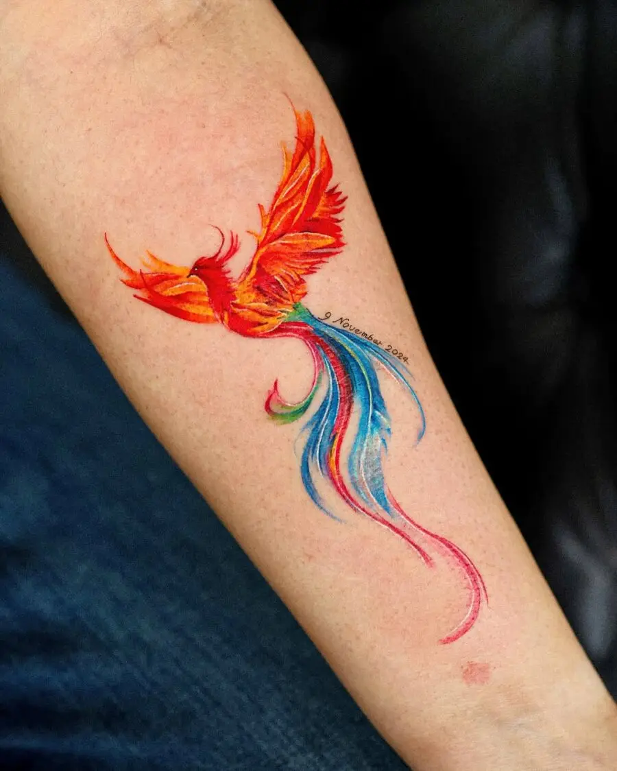 Vibrant phoenix tattoo with flowing colors.