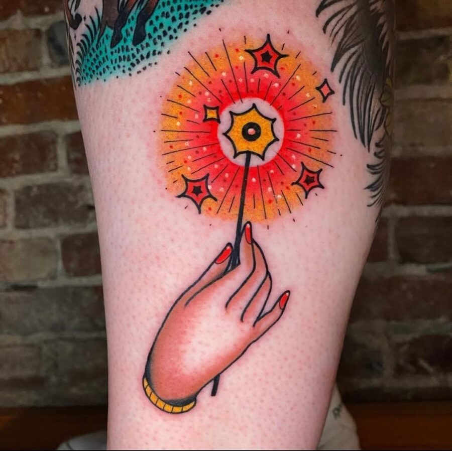 Vibrant hand holding a sparkling wand