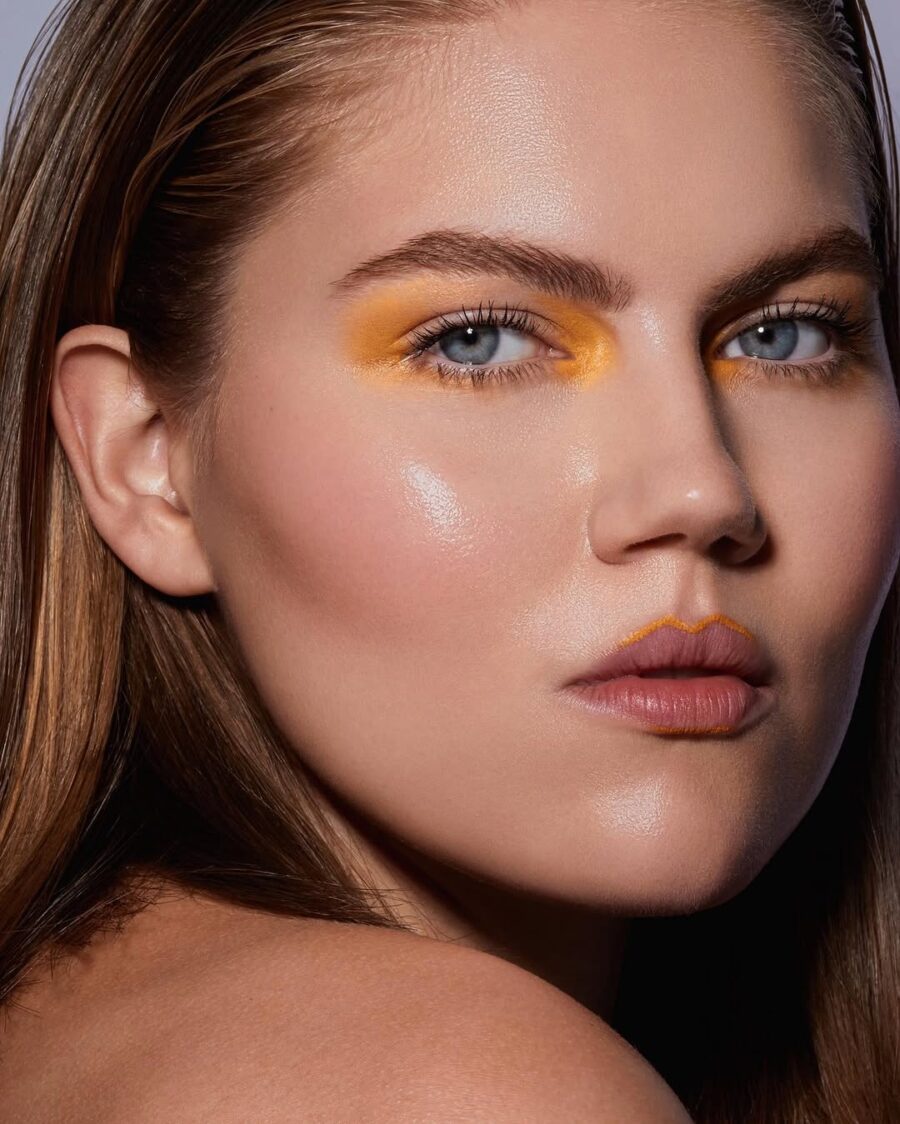 Vibrant yellow eyeshadow enhances natural beauty