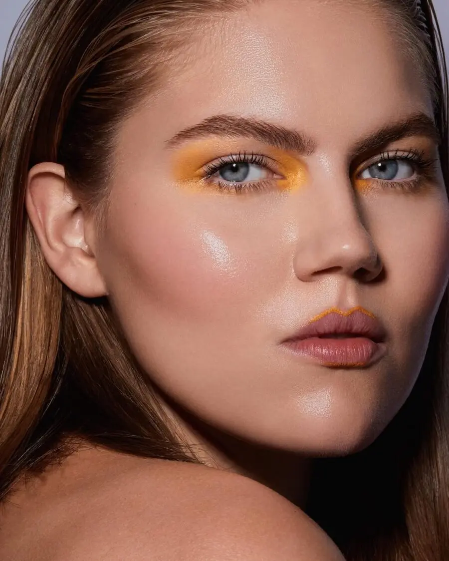 Vibrant yellow eyeshadow enhances natural beauty