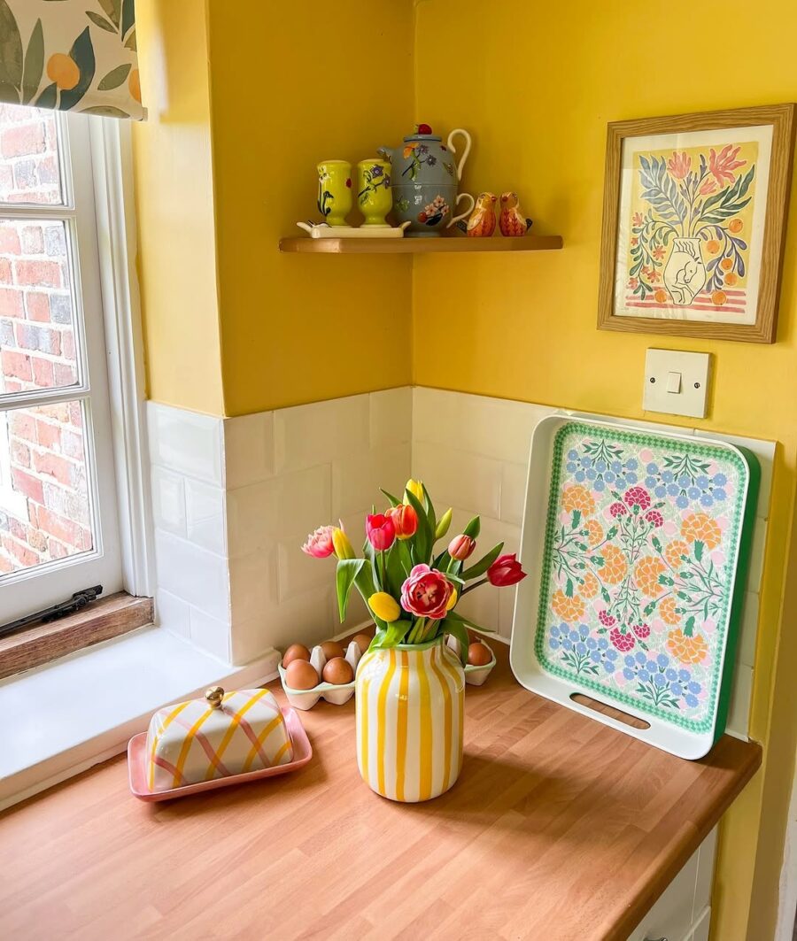 Vibrant yellow kitchen full of cheerful decor