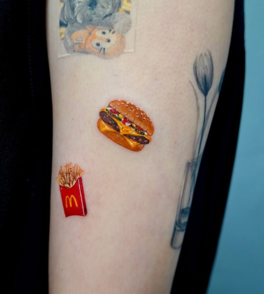 Deliciously detailed burger and fries tattoo art