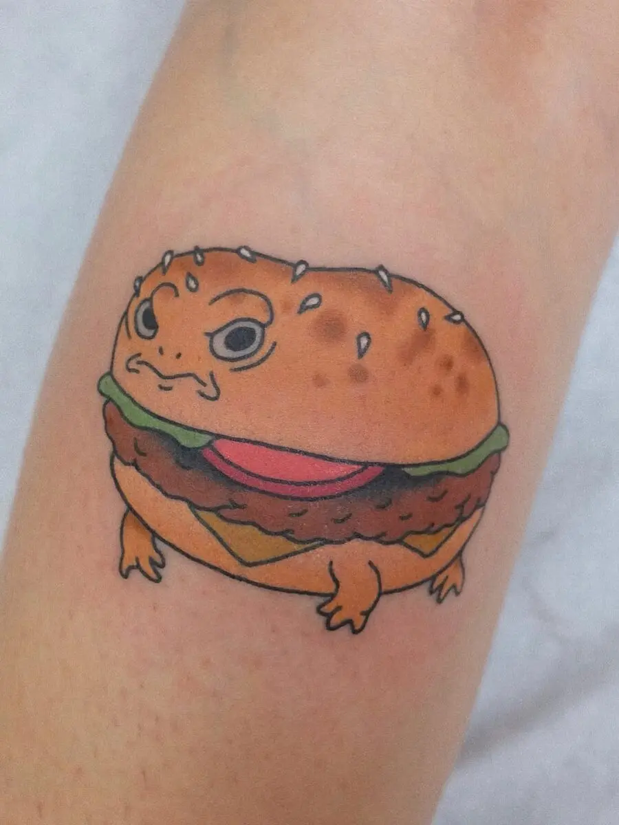 Whimsical burger tattoo with a quirky twist