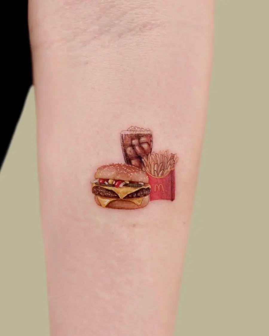 Delicious burger tattoo with fries and drink
