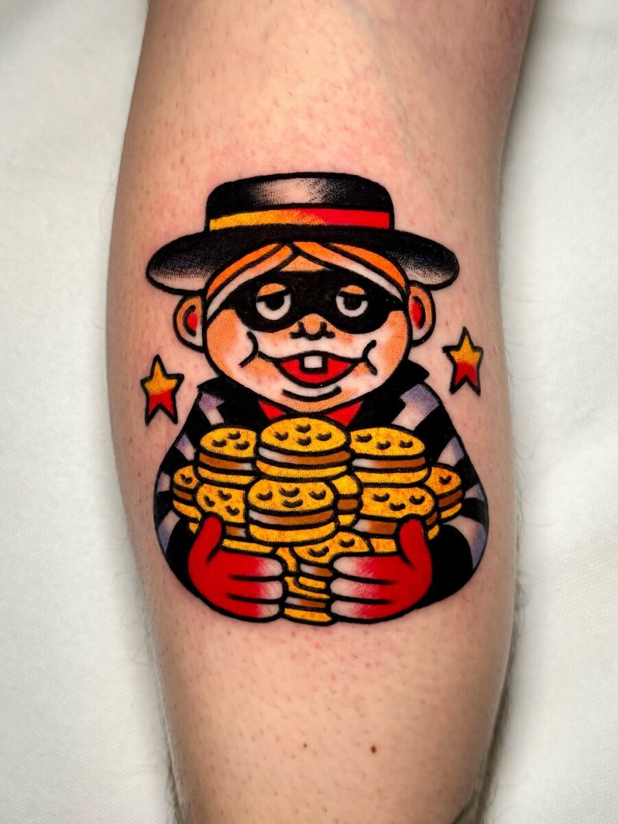 Playful burger-themed character tattoo design