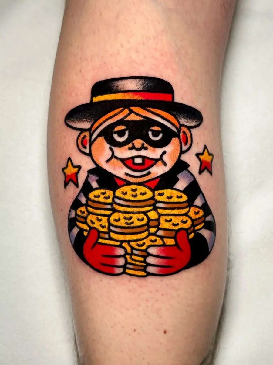 Playful burger-themed character tattoo design