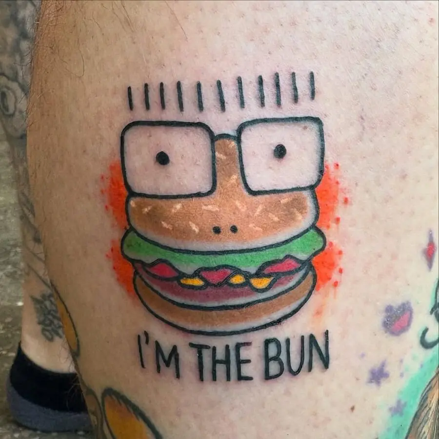 Playful burger character with quirky glasses tattoo