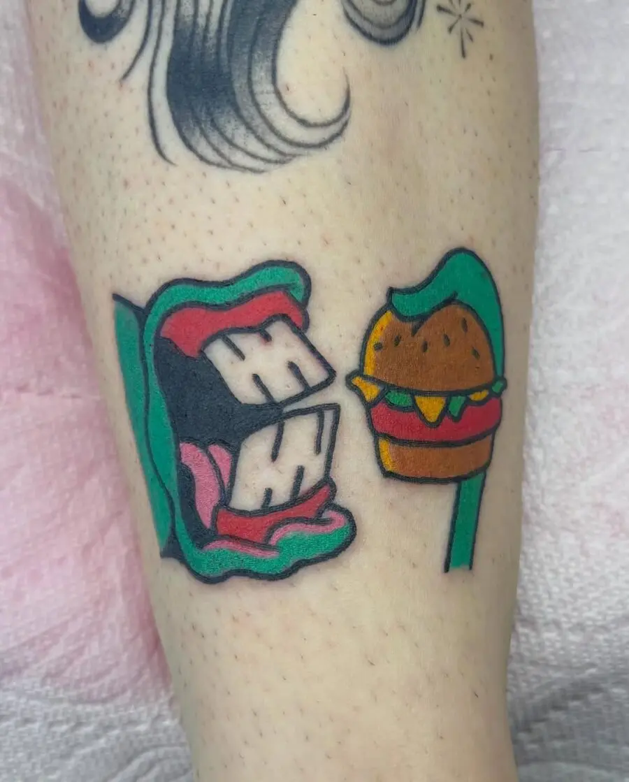 Playful mouth and burger tattoo design