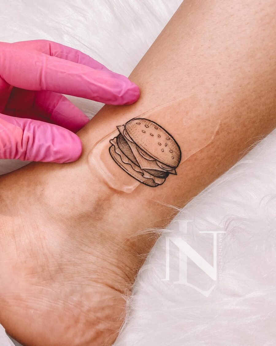 Whimsical burger tattoo on the wrist