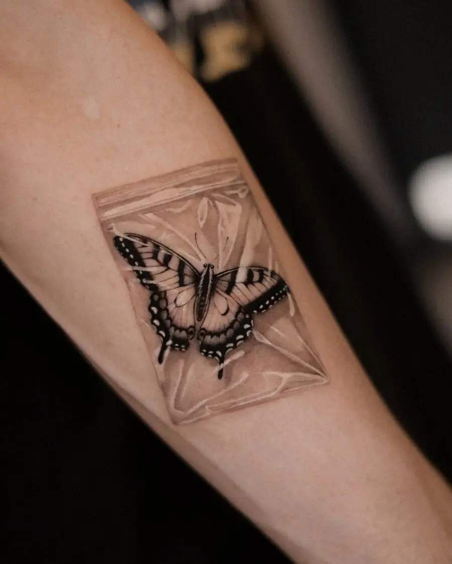 Intricate butterfly tattoo in a bag design