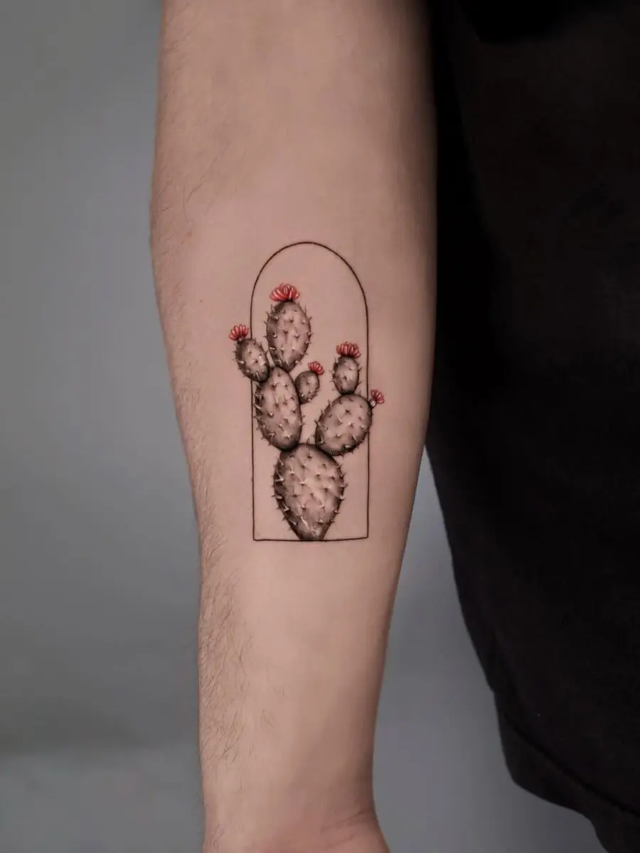 Vibrant cactus tattoo with floral accents