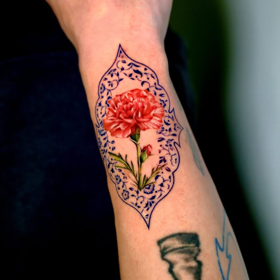 Elegant carnation tattoo with ornate detailing
