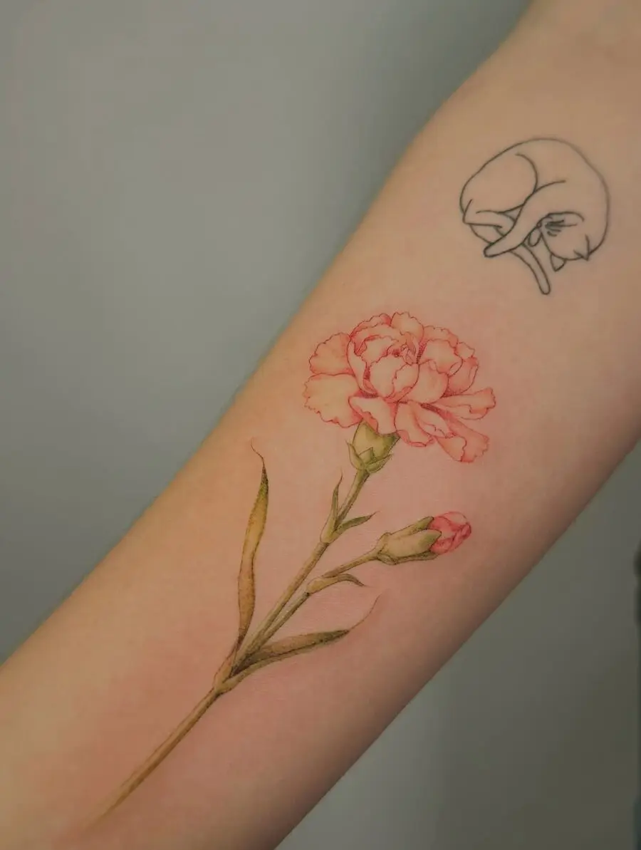 Elegant Carnation Tattoo Blending Realism and Art
