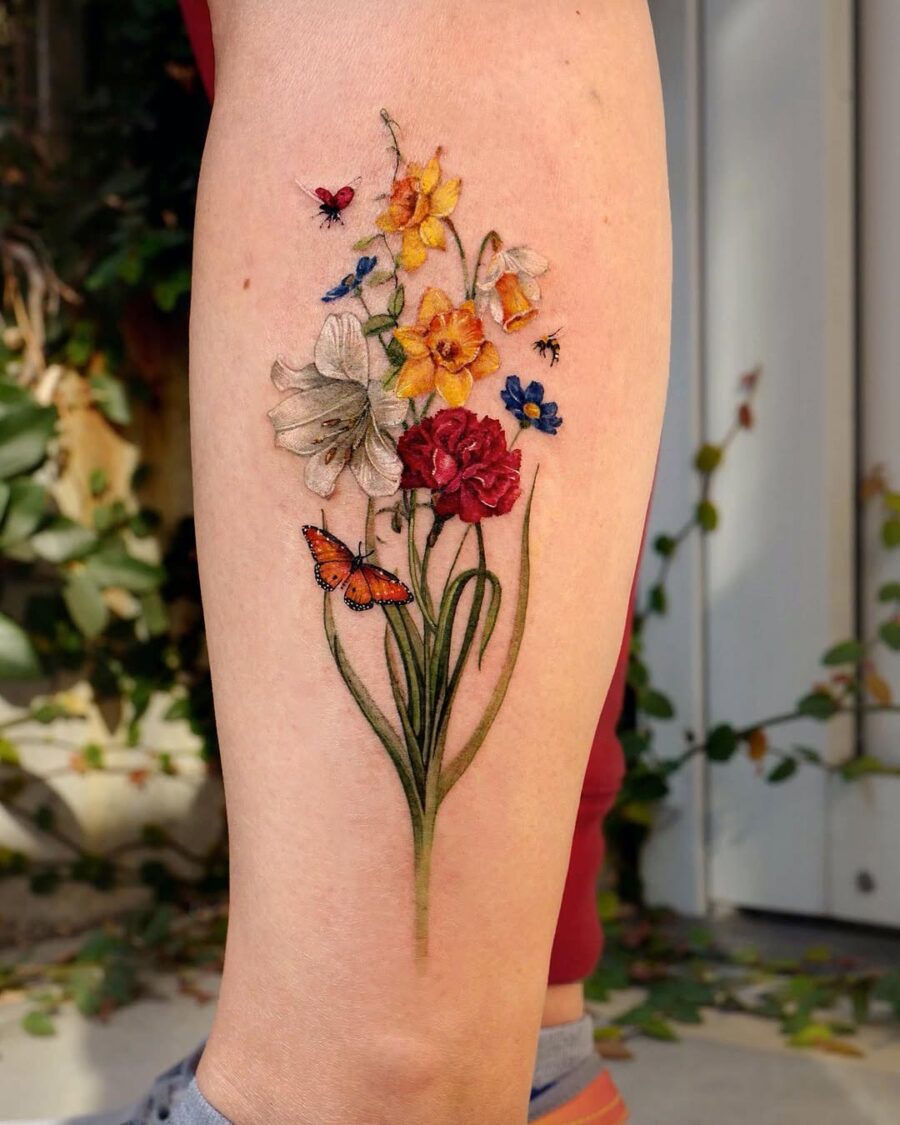 Colorful carnation tattoo with delicate floral details