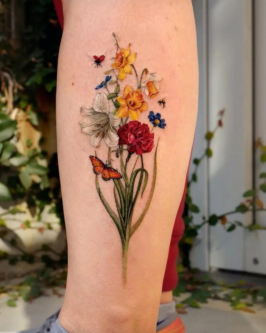 Colorful carnation tattoo with delicate floral details