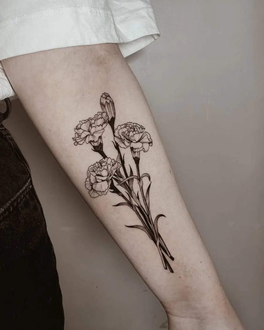 Elegant black ink carnation tattoo design