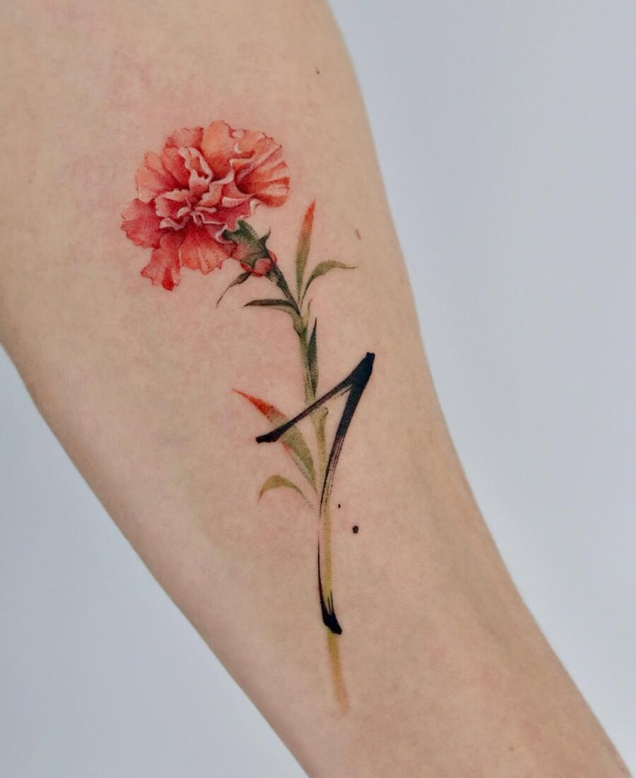 Vibrant carnation tattoo with delicate details