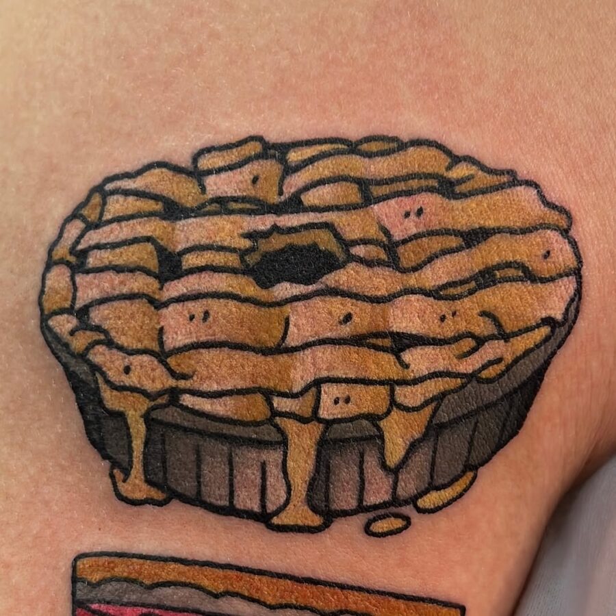 Whimsical pie tattoo with playful expressions