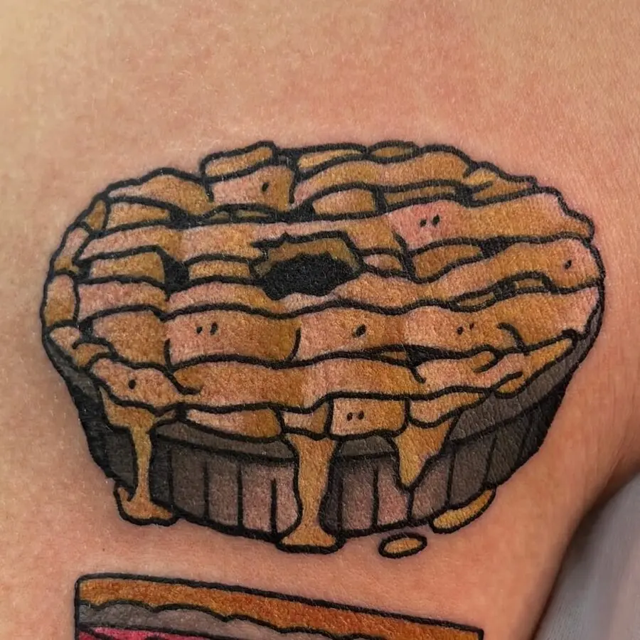 Whimsical pie tattoo with playful expressions