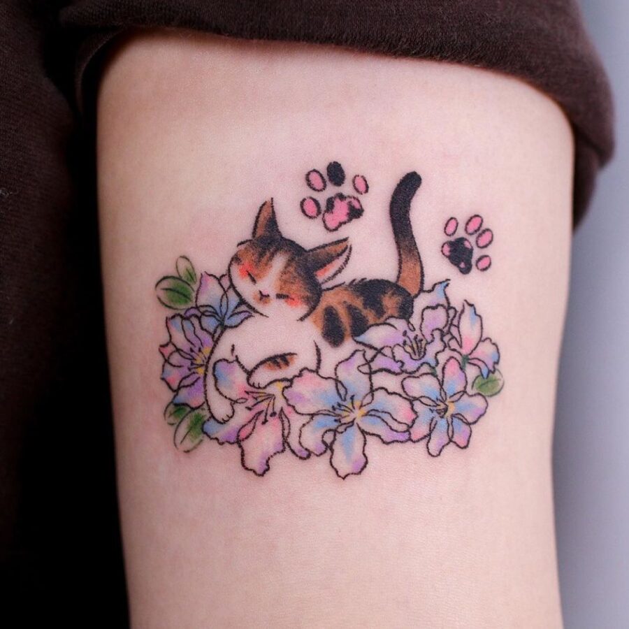 Charming cat resting among colorful flowers