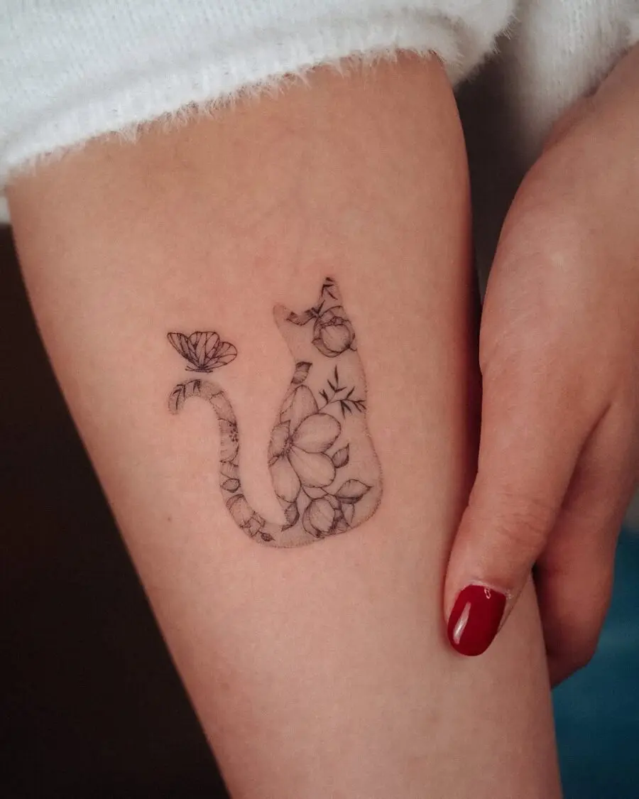 Delicate floral cat silhouette tattoo design