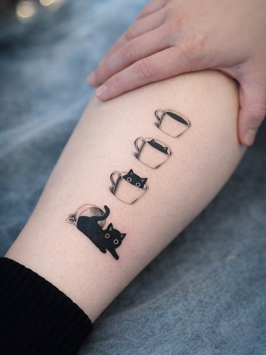 Charming Cat-Inspired Minimalist Tattoo Design
