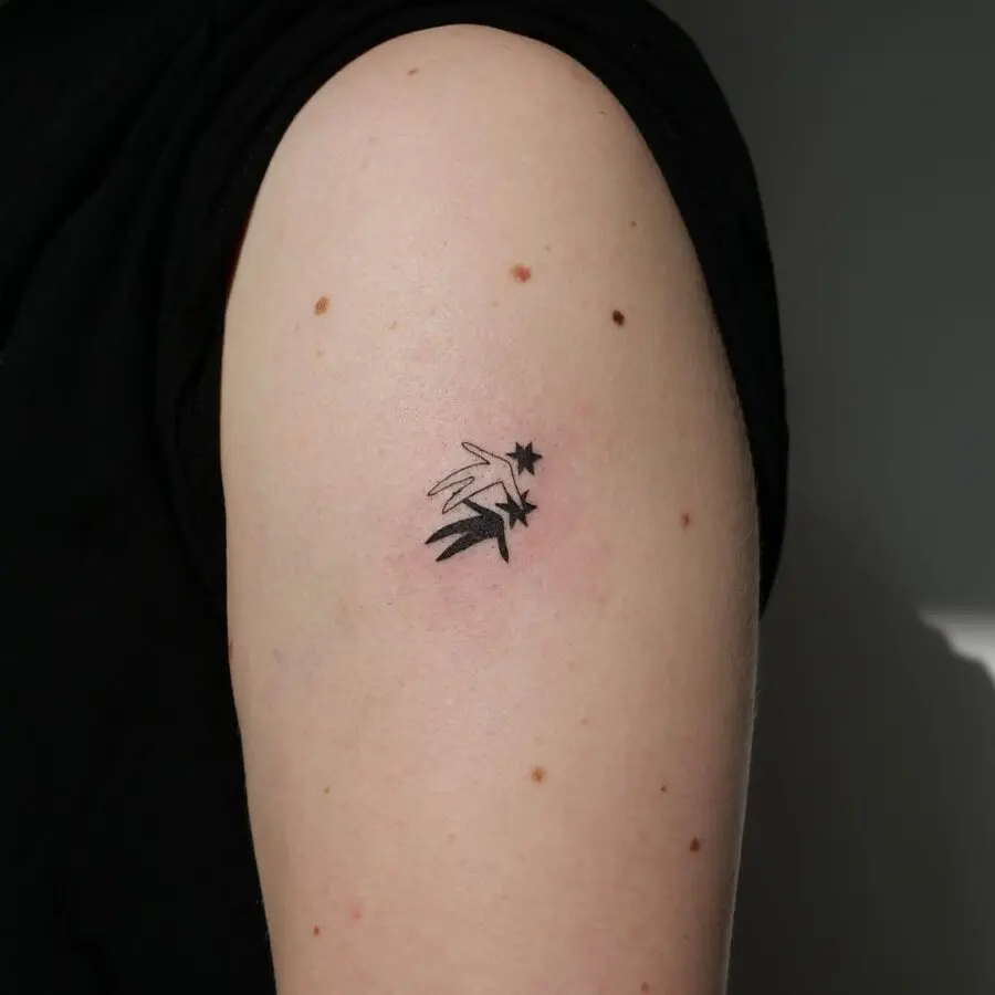 Minimalist celestial star tattoo on arm