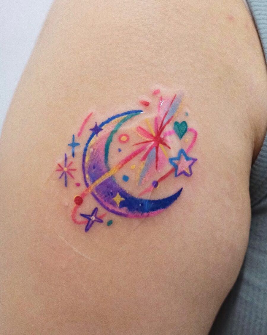 Vibrant celestial tattoo featuring moon and stars
