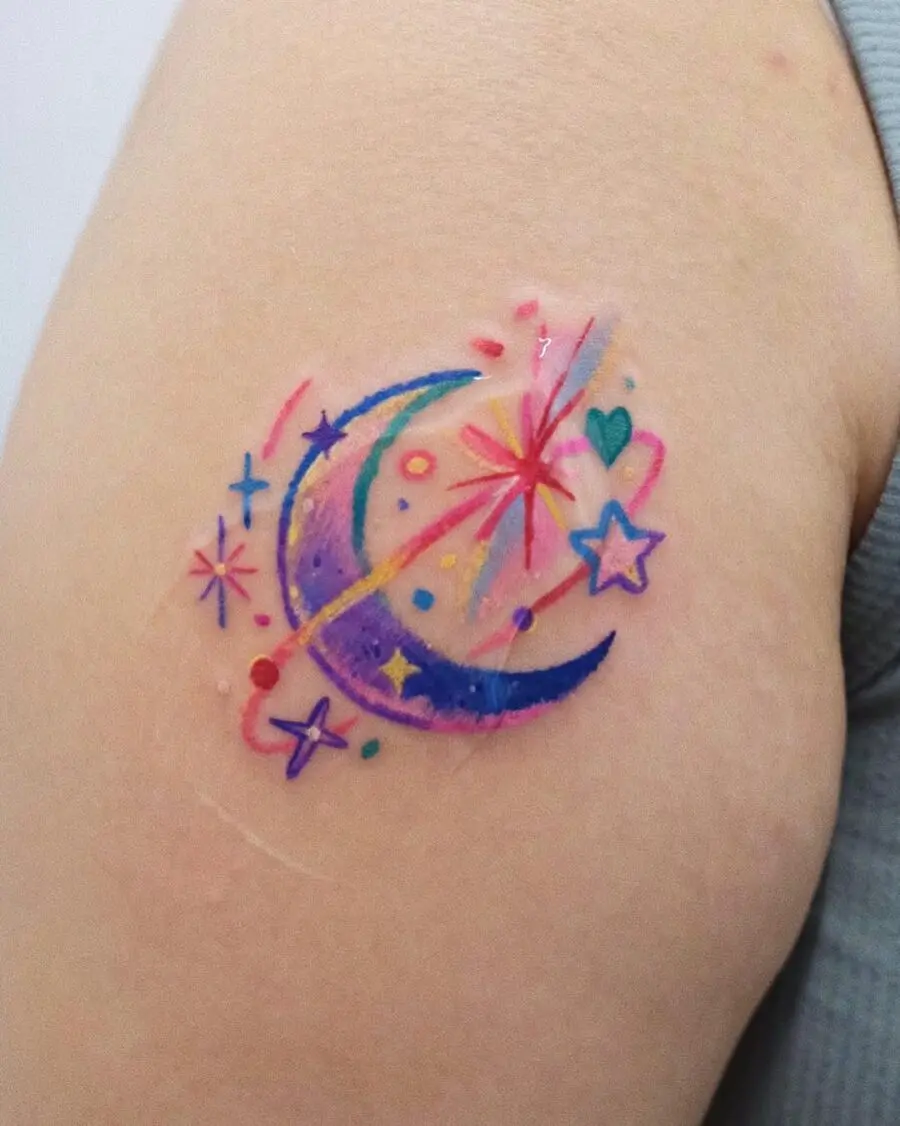 Vibrant celestial tattoo featuring moon and stars