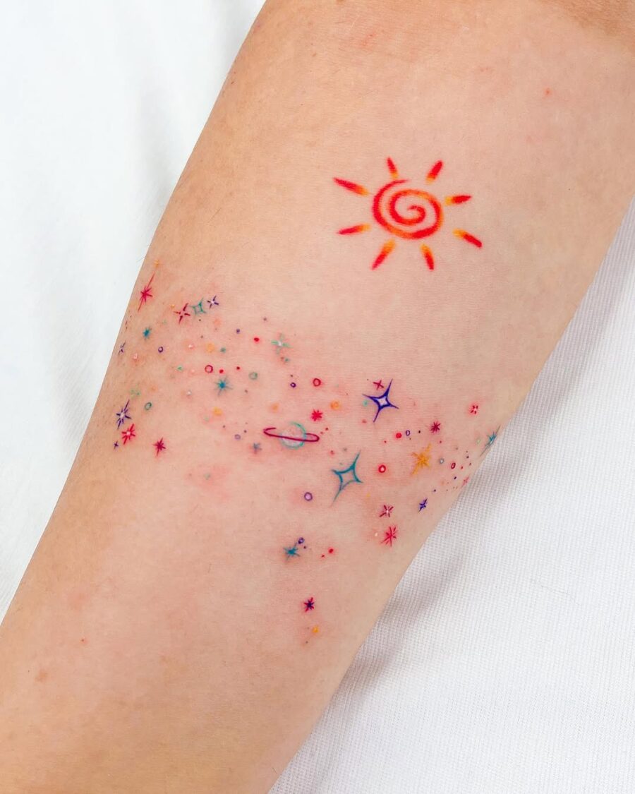 Vibrant celestial tattoo showcasing sun and stars