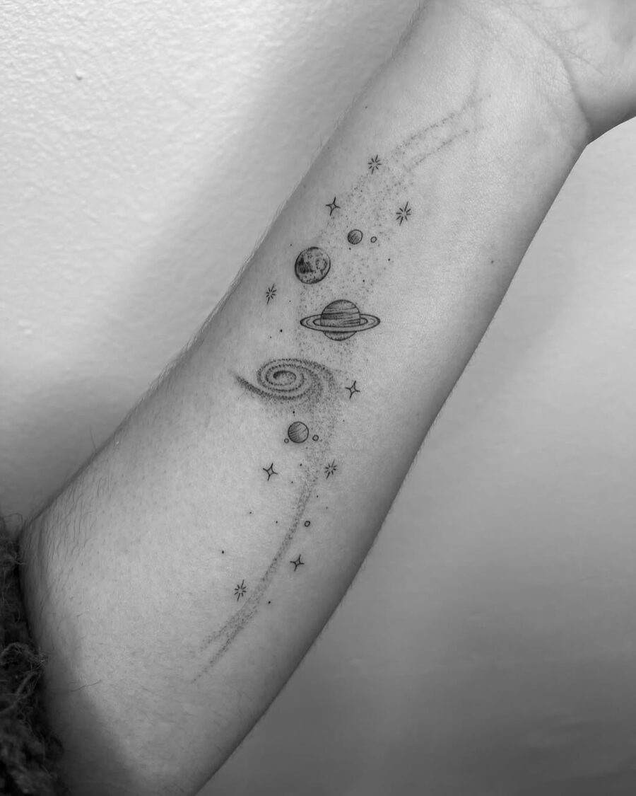 Stunning celestial tattoo with planets and stars