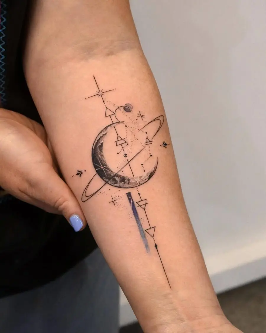 Elegant cosmic designs on a forearm.