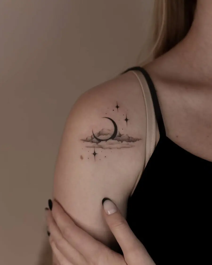Elegant celestial tattoo featuring moon and stars