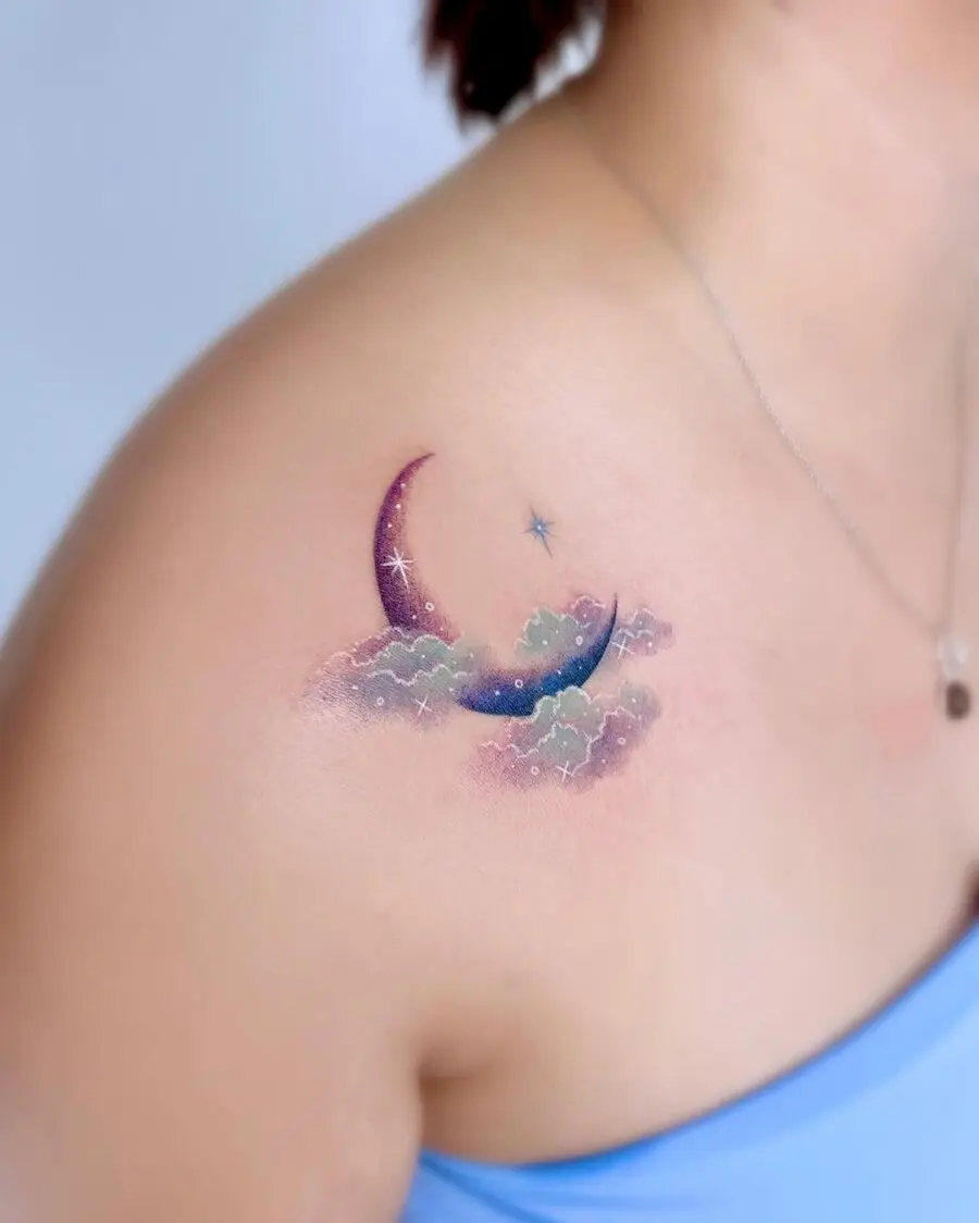 Enchanting moon and stars tattoo in soft colors