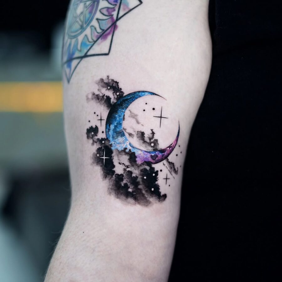 Captivating crescent moons and cosmic clouds tattoo