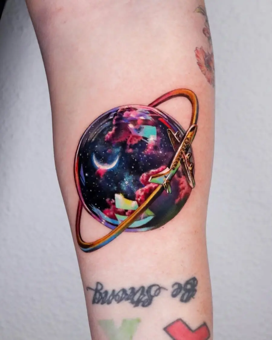 Vibrant Planetary Tattoo with a Spaceship