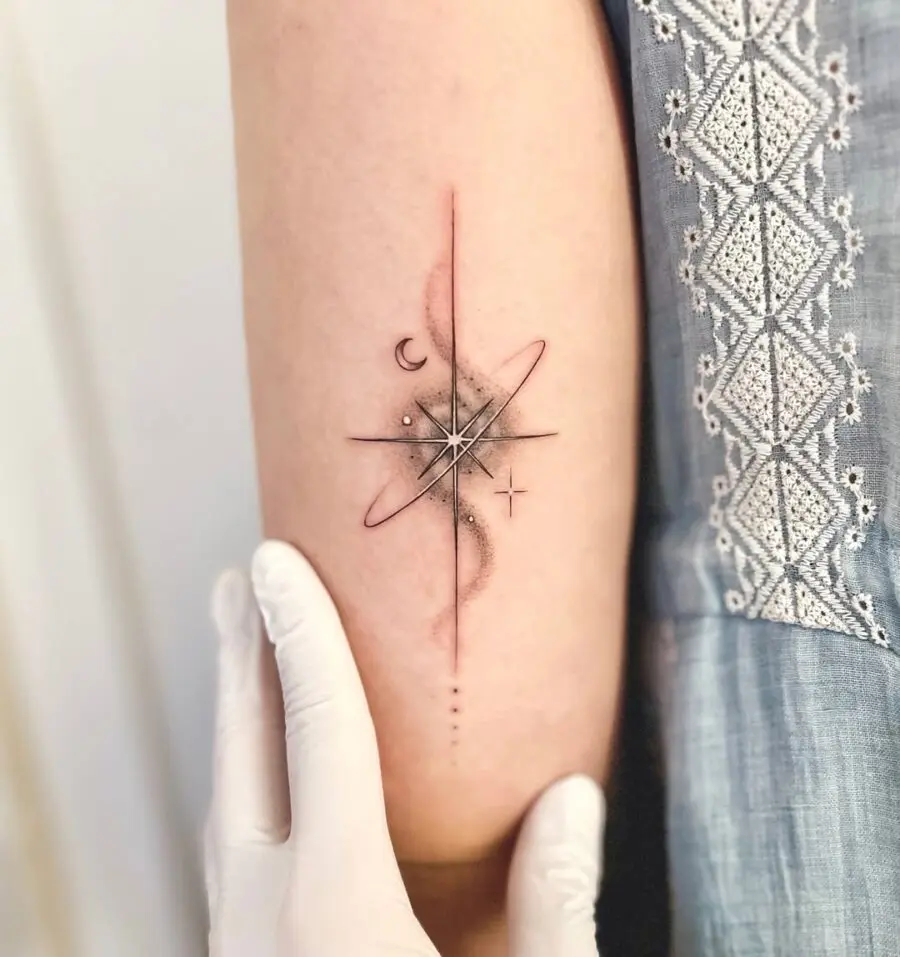 Elegant celestial tattoo featuring star and planet
