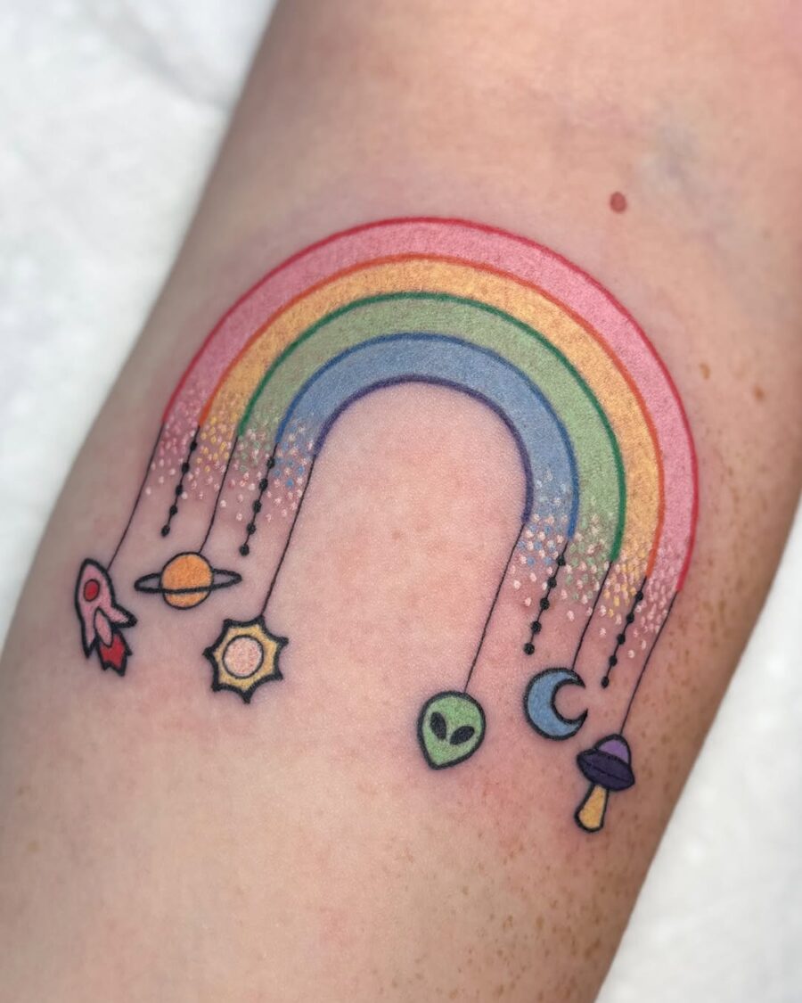 Colorful rainbow with cosmic elements tattoo design