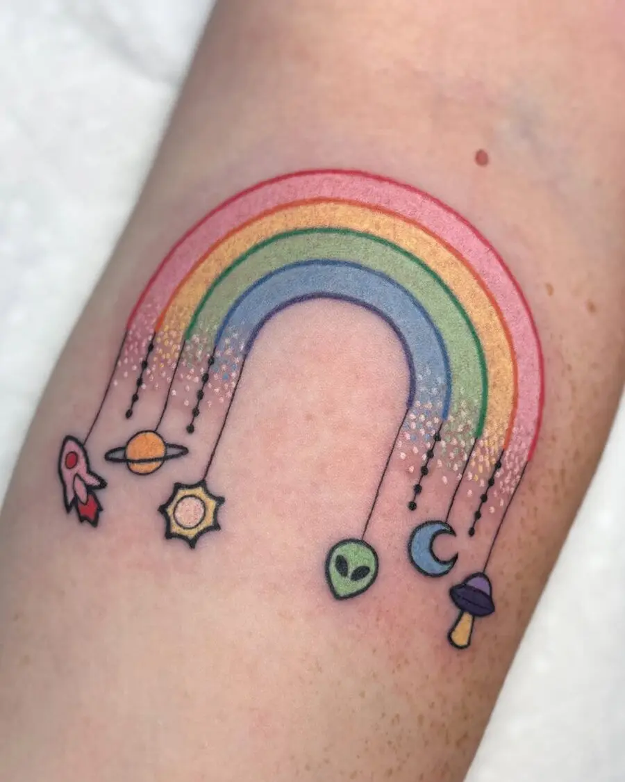 Colorful rainbow with cosmic elements tattoo design