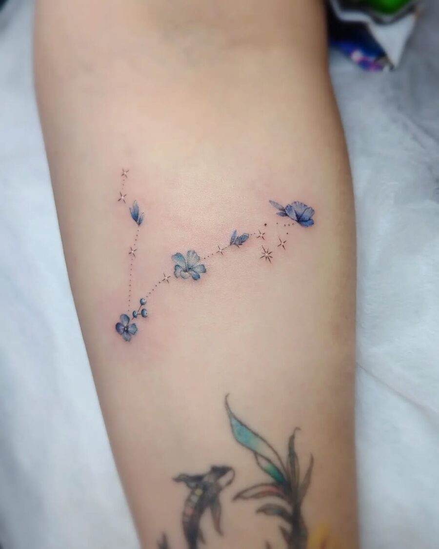 Delicate celestial tattoo with butterflies and flowers