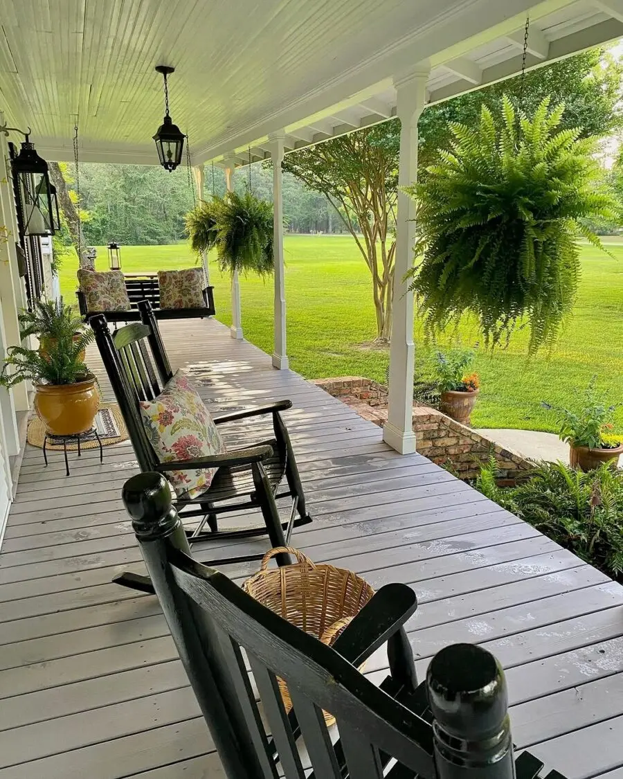 Inviting porch with lush greenery and seating