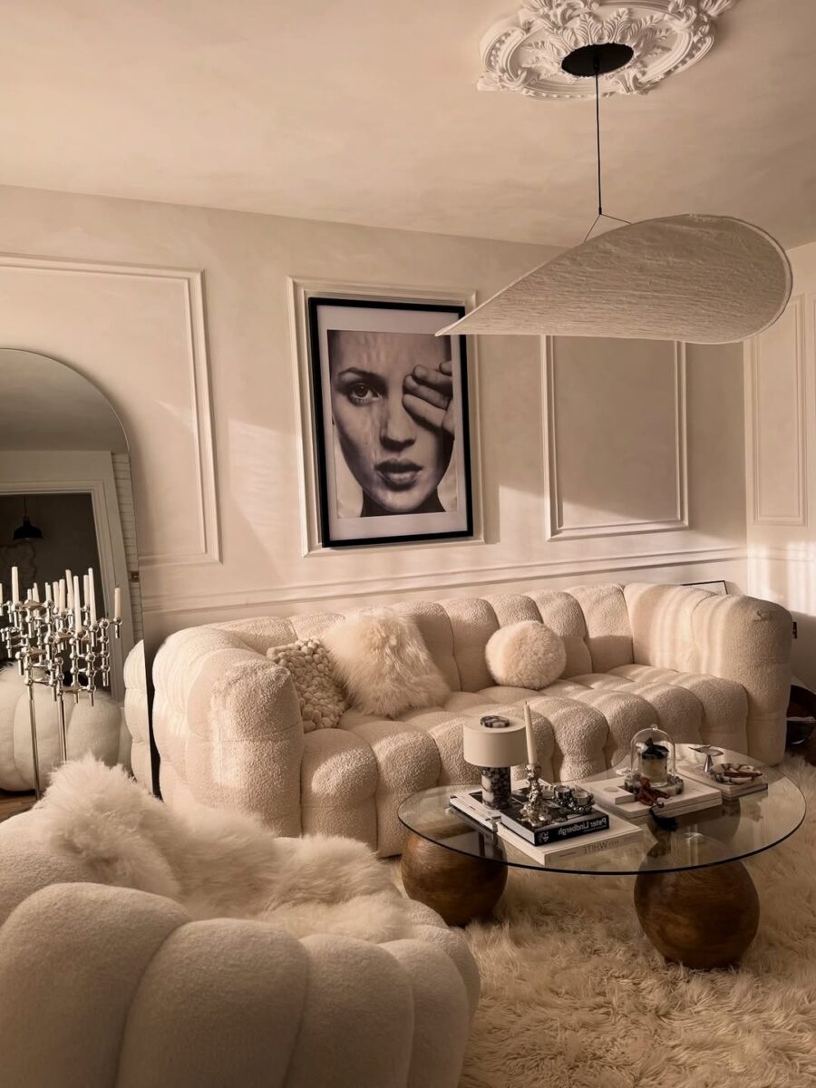 Stylish sofa with elegant artwork above
