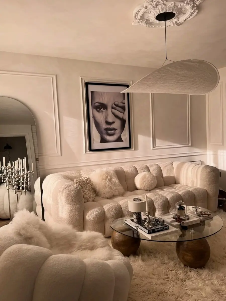 Stylish sofa with elegant artwork above